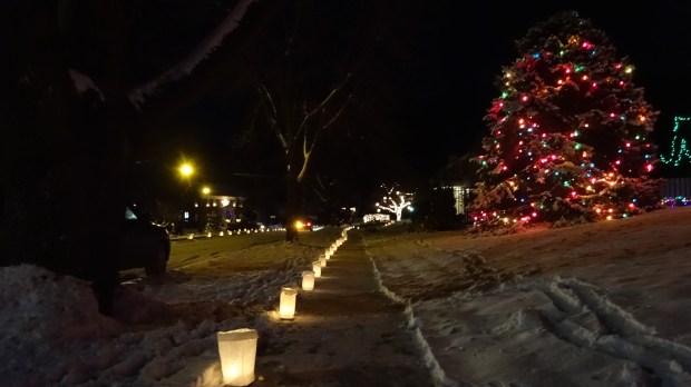 Candles line the sidewalks